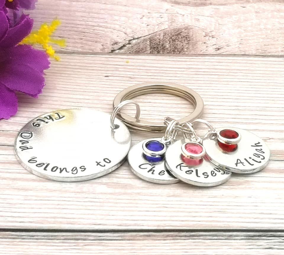 This Dad belongs to keyring. Multiple name charms & birthstone crystals
