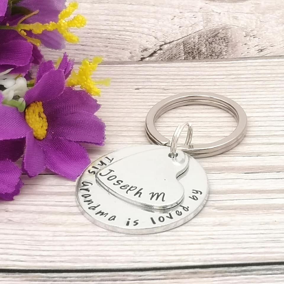 This Grandma is loved by. Personalised keyring. Heart & circle charm
