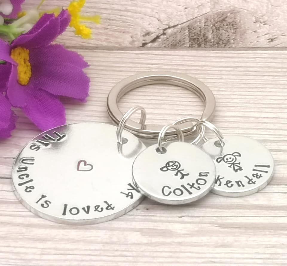 This Uncle is loved by keyring. Multiple charms with name & stick people