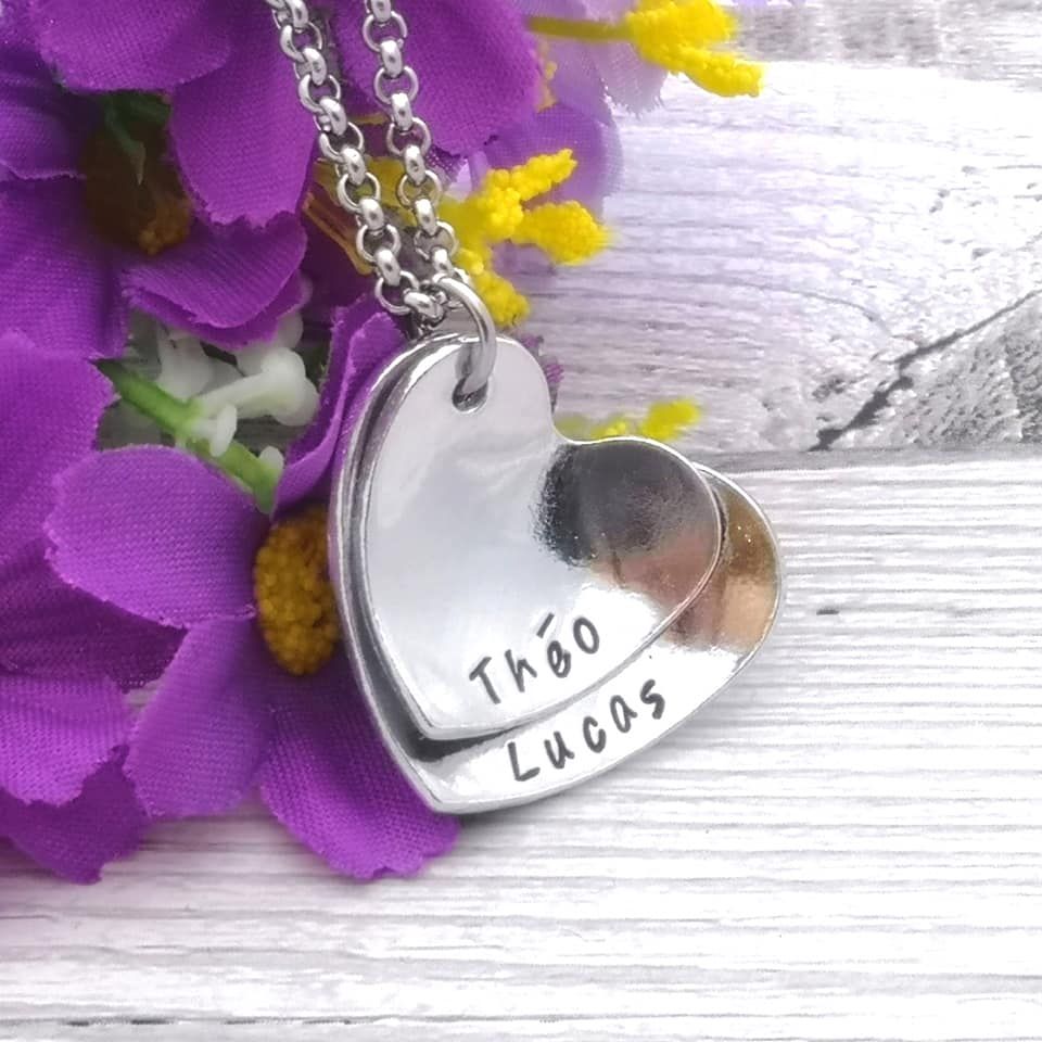 Two heart necklace personalised with names. Hearts domed & layered