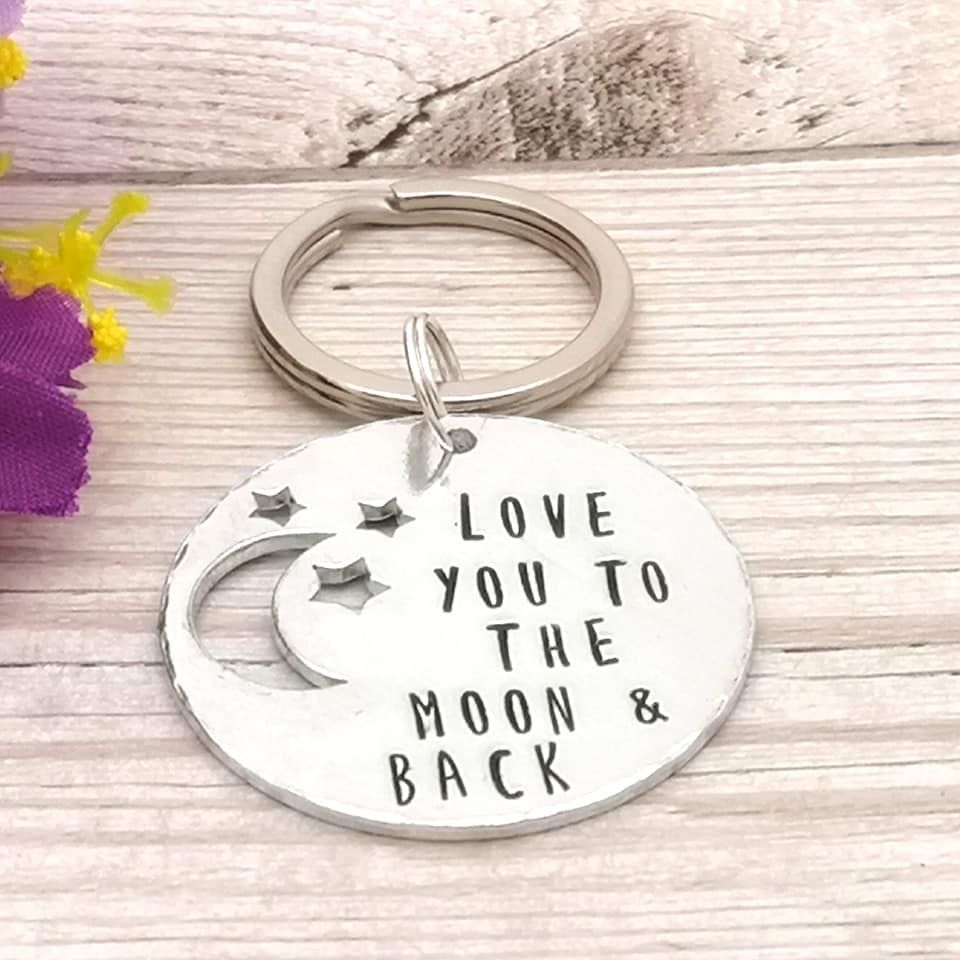 Round metal keyring with moon & stars cut out. Love you to the moon & back