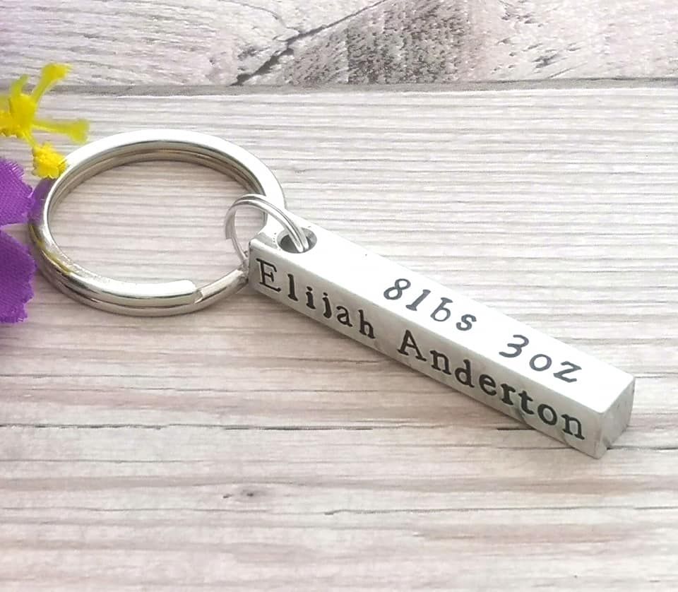 Chunky metal bar keyring personalised with baby birth details.