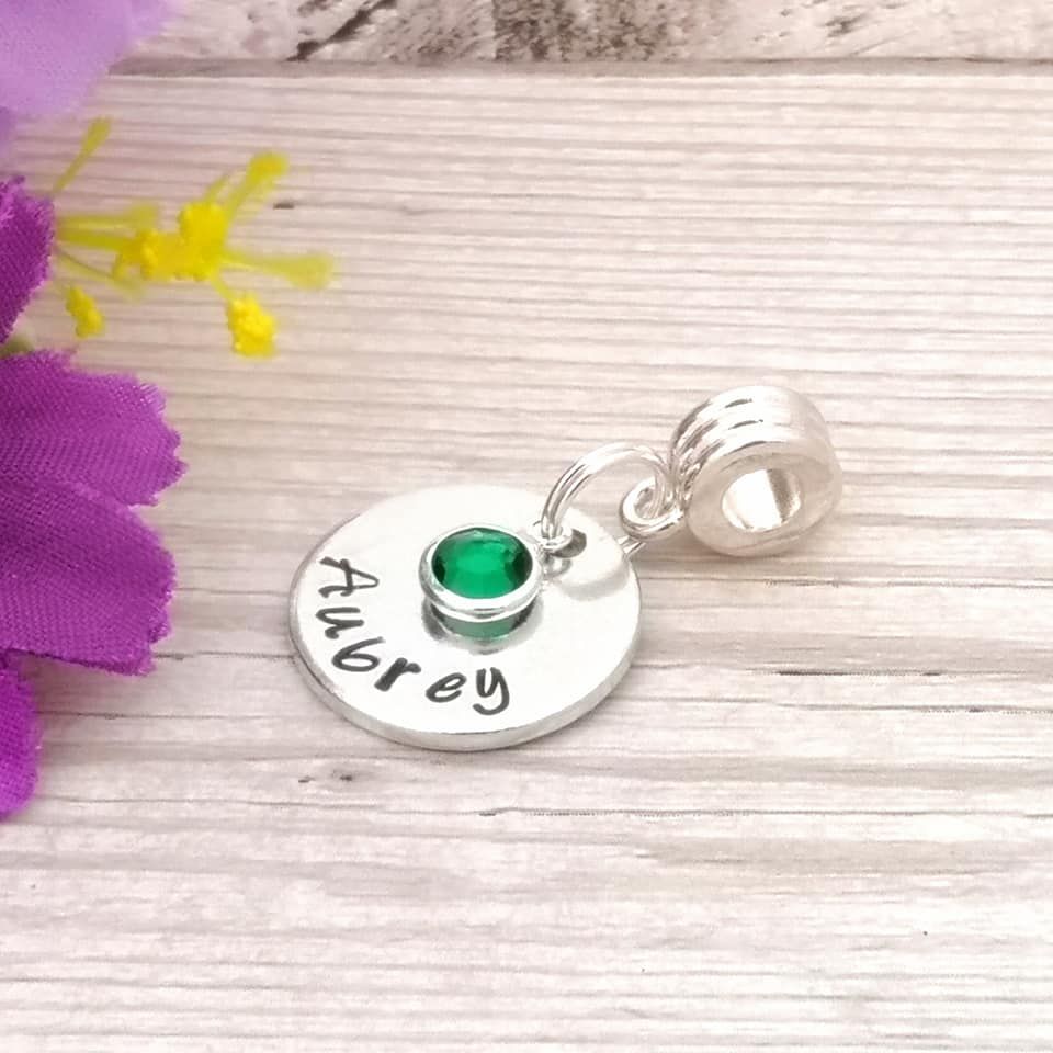 Small bracelet charm with birthstone crystal. Disc charm, fluted carrier
