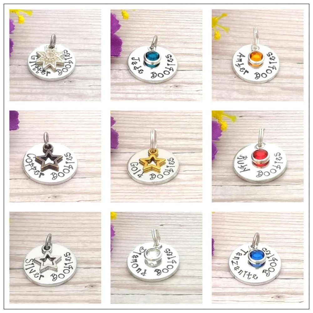 Small circular breastfeeding award charm. 9 different charms are shown