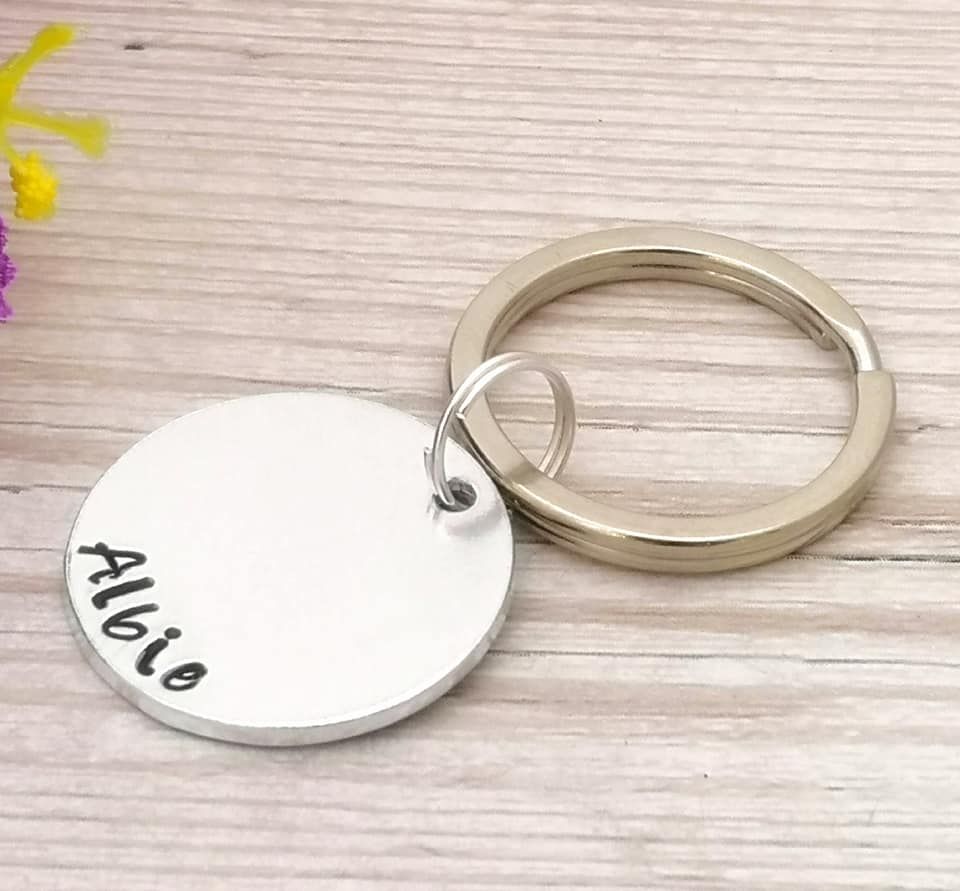 Single metal disc keyring personalised with a name