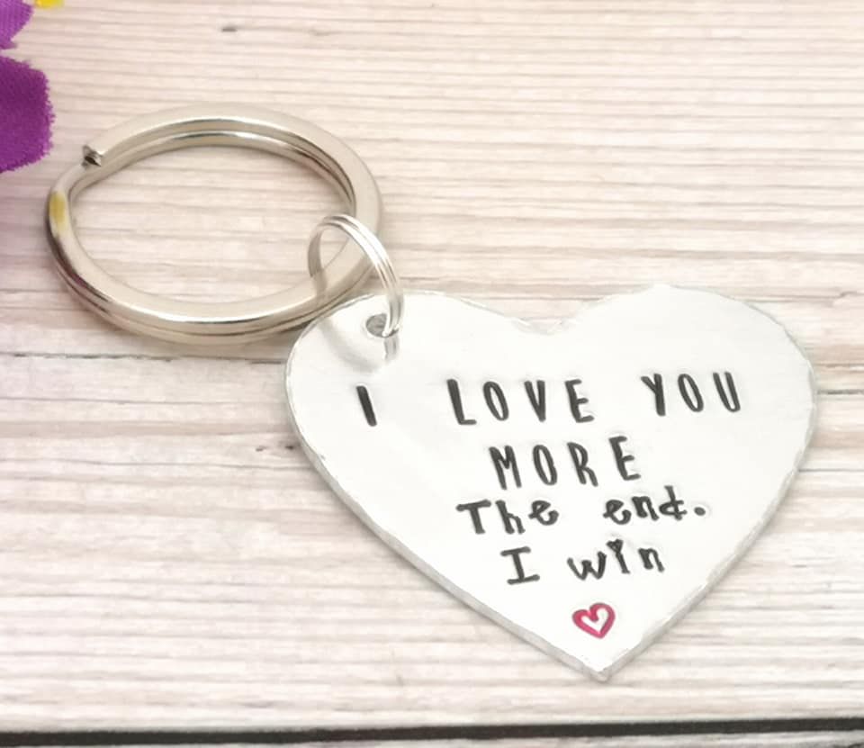 Heart shaped keyring with wording: I love you more The end. I win
