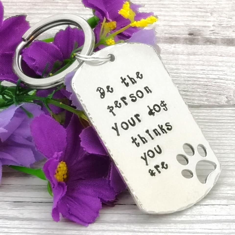 Be the person your dog thinks you are. Dog tag shaped metal keyring