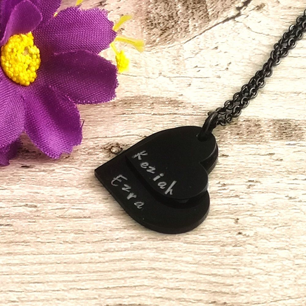 Black stacked heart necklace. Two black hearts & chain, white  letters