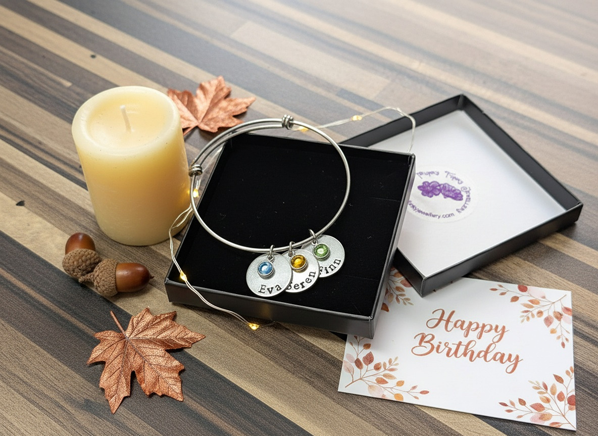 Custom family bracelet in gift box with birthday card and candle, perfect personalised gift.