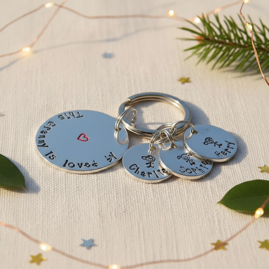 Hand-stamped aluminium stick people keyring personalised for mum or nanny, handmade in Somerset.