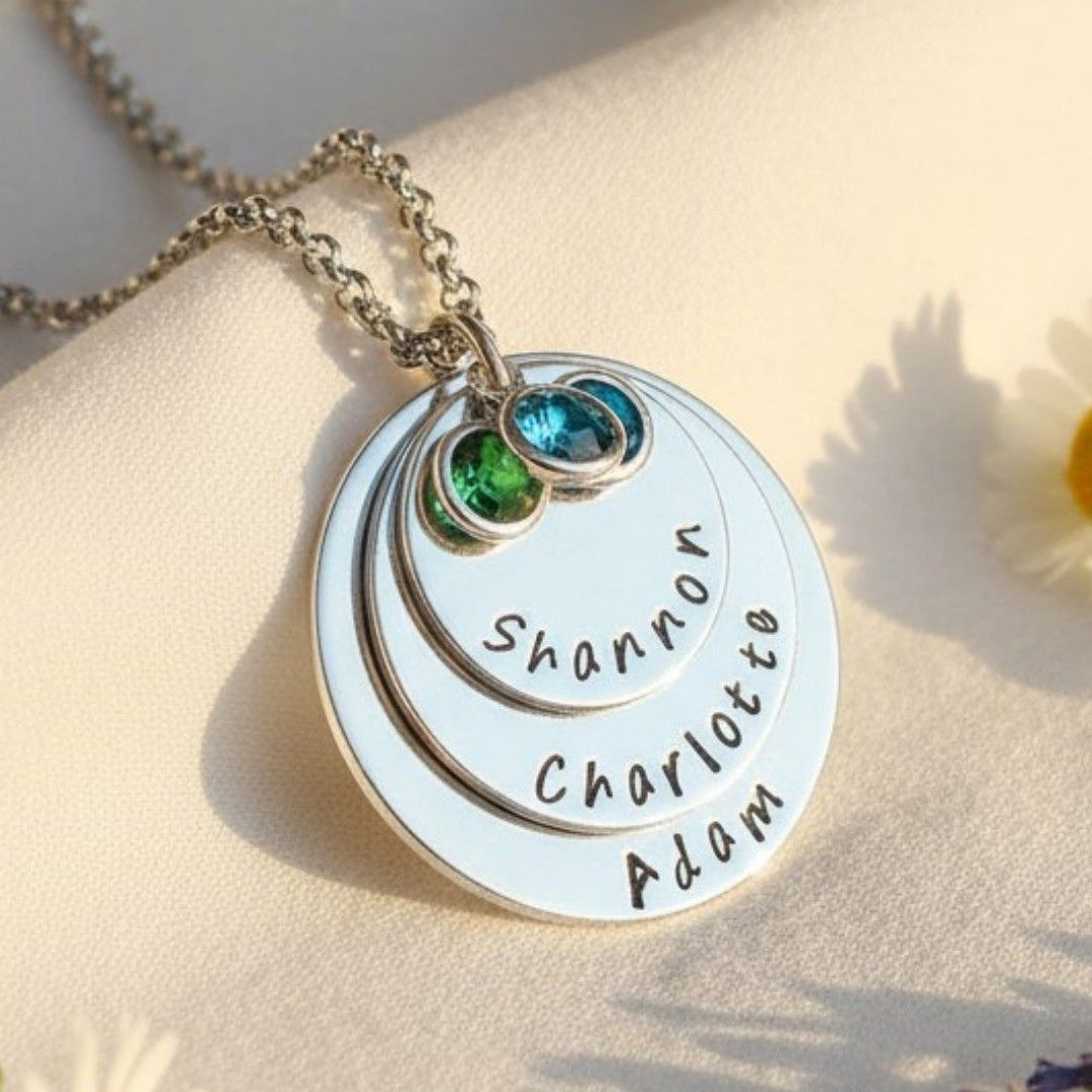 Hand-stamped family name disc necklace with birthstone crystals