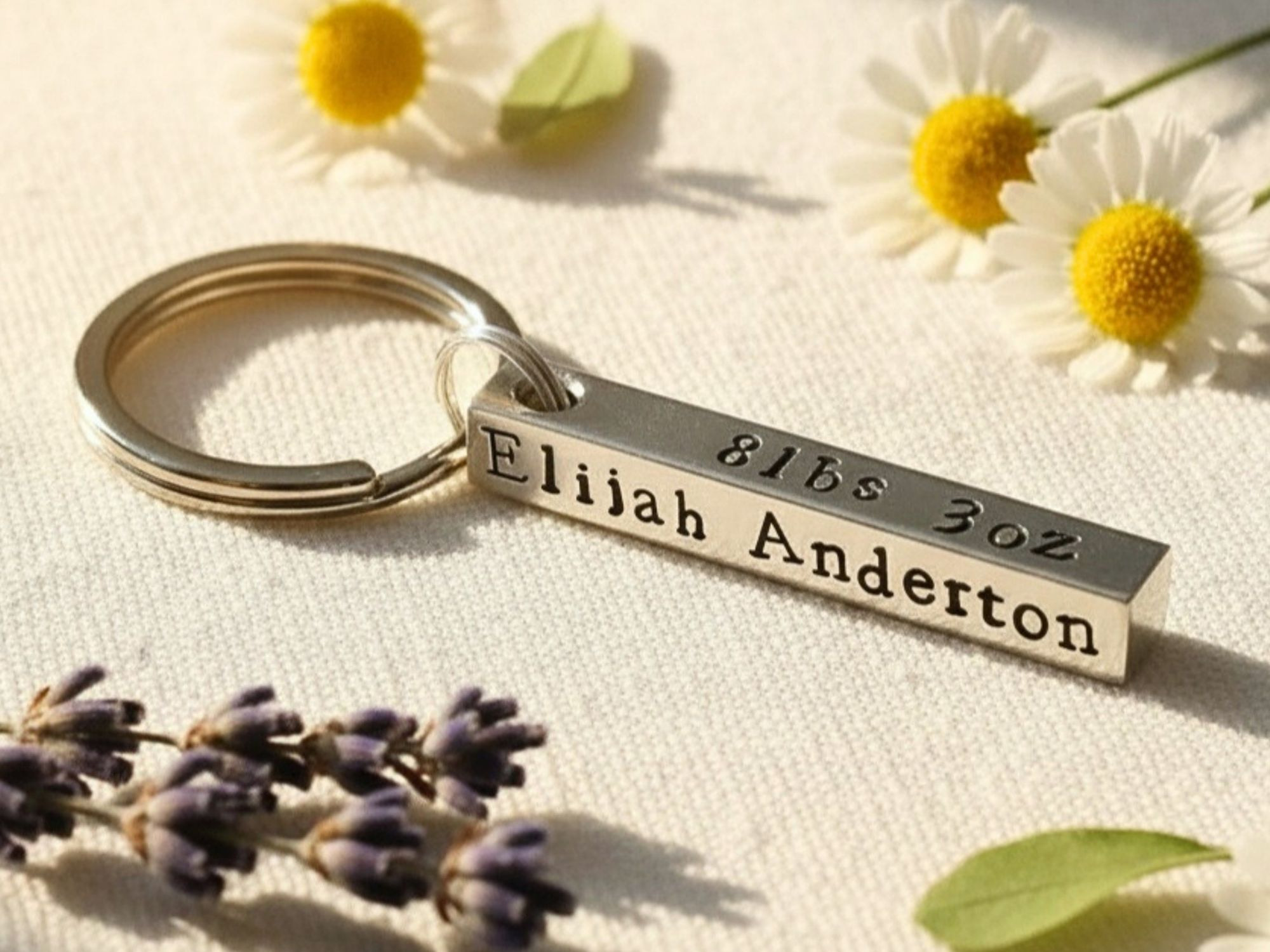 Hand stamped aluminium baby birth details keyring with personalised birth information