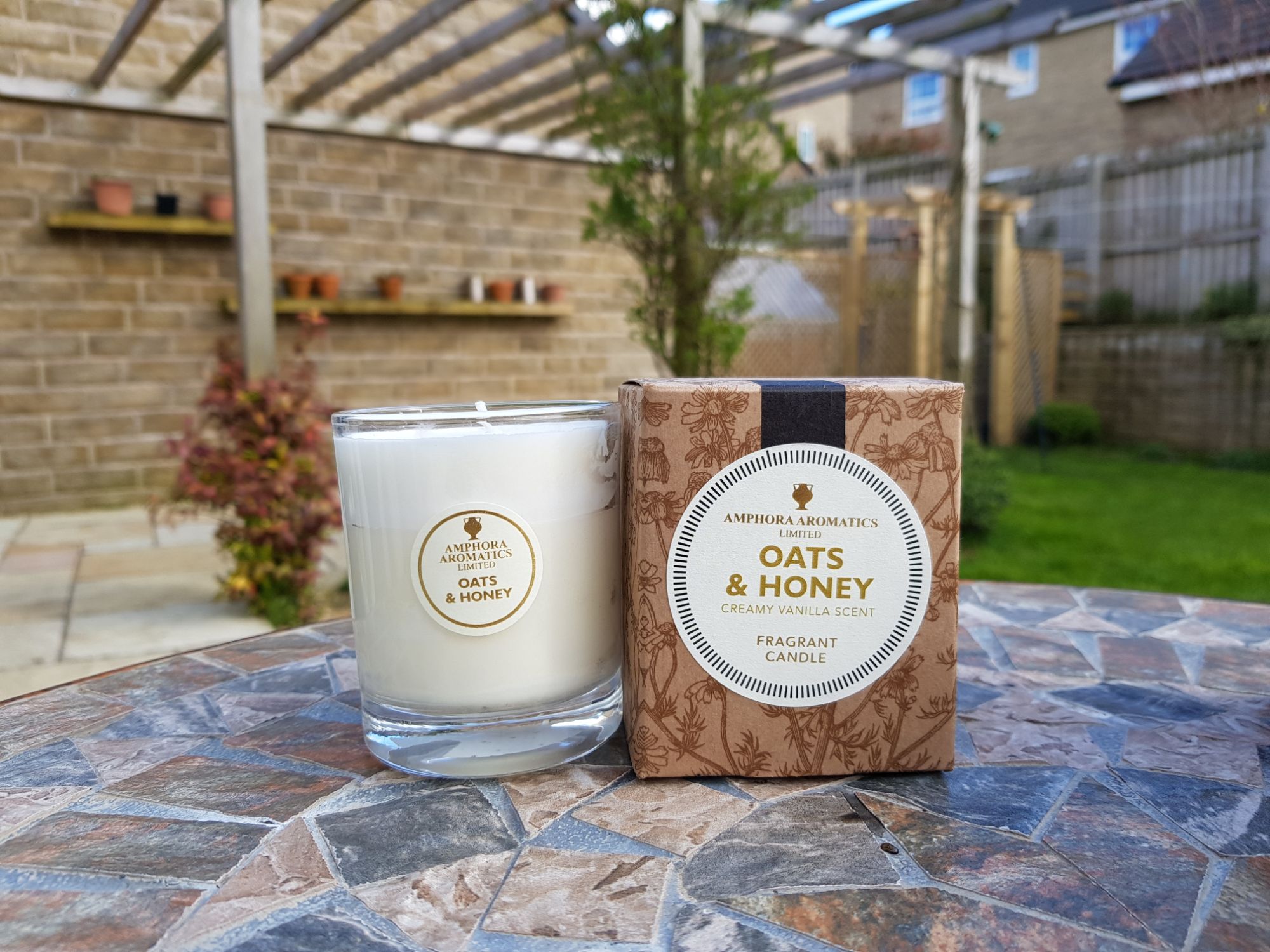 Oats and Honey Glass pot candle on a table