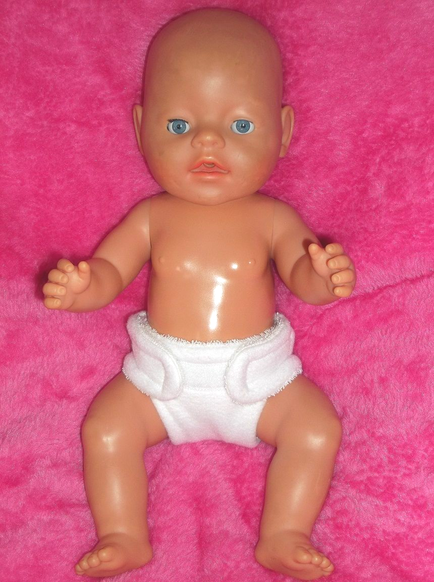 Doll wearing a white nappy