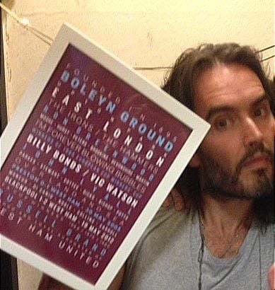 Comedian Russell Brand holding his West Ham Utd Framed Memories print from Fox On The Hill Prints