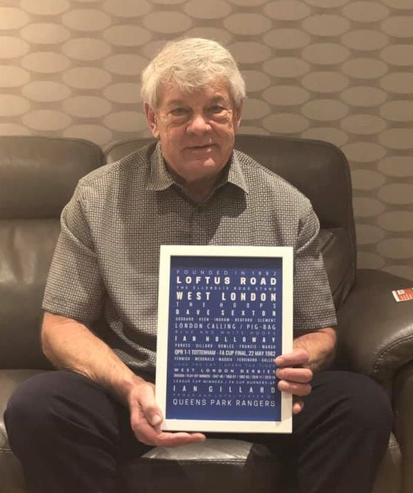 QPR legend left-back Ian Gillard holding his QPR Memories framed print from Fox On The Hill Prints