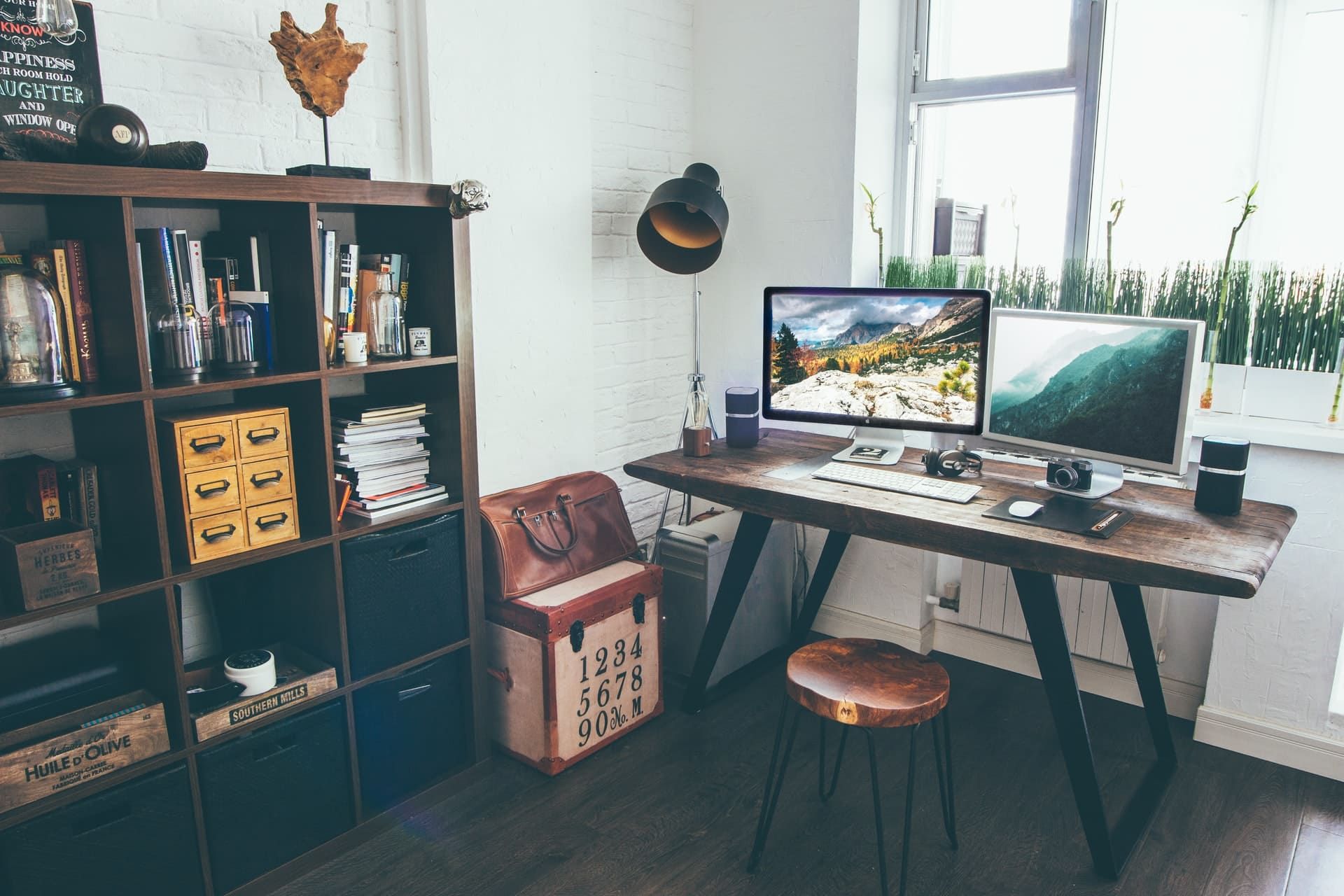 Wooden desk with two computer monitors