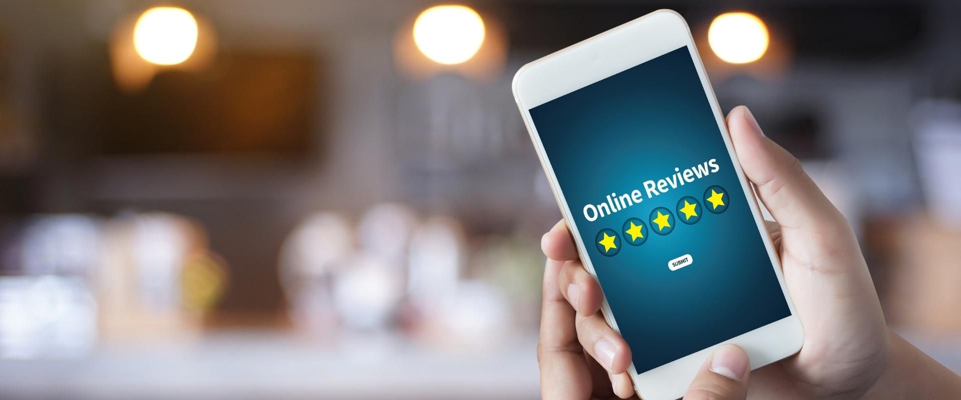 Mobile phone with 5 stars and 'Online Reviews' on screen