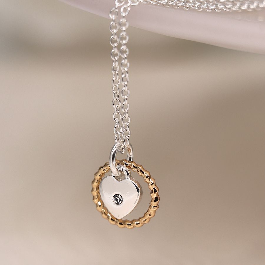 Silver plated necklace with heart and golden twist hoop