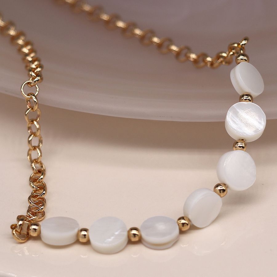 Golden chain and pearl disc necklace