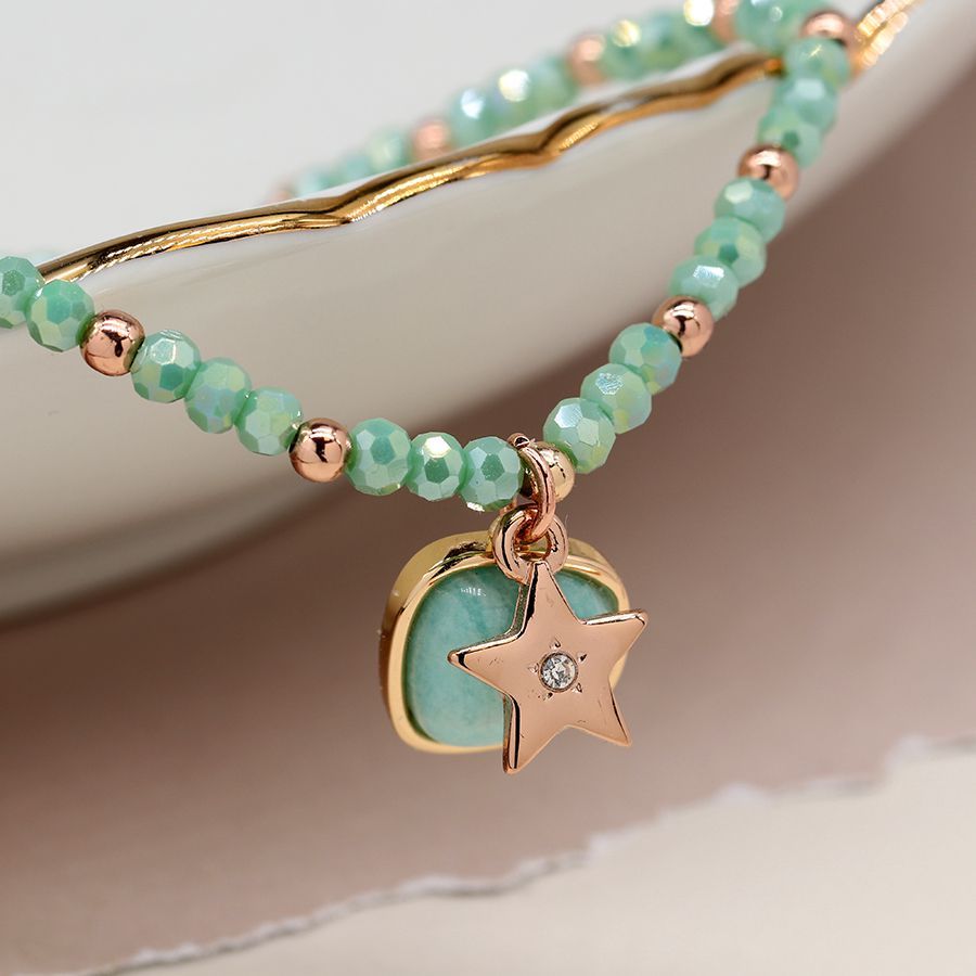Sea green and golden charm bracelet with star and stone