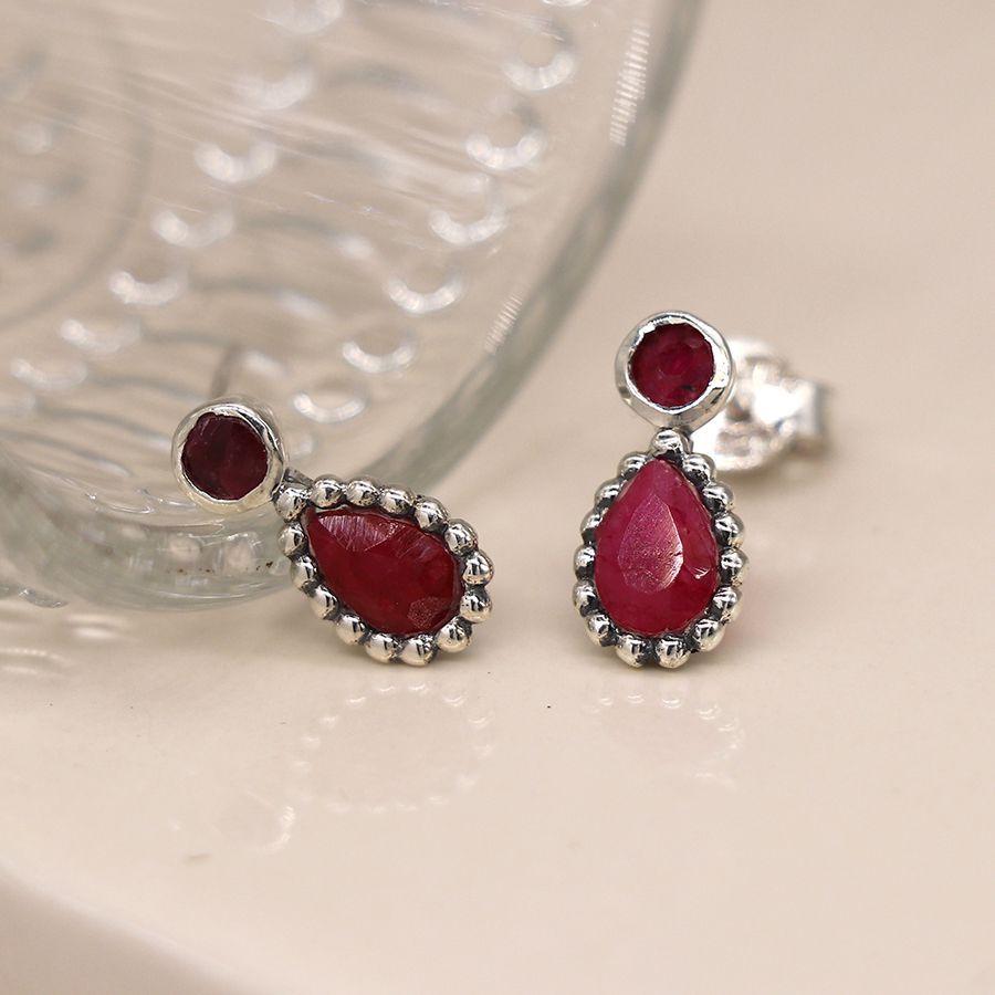 Sterling silver ruby earrings with dotted silver edge