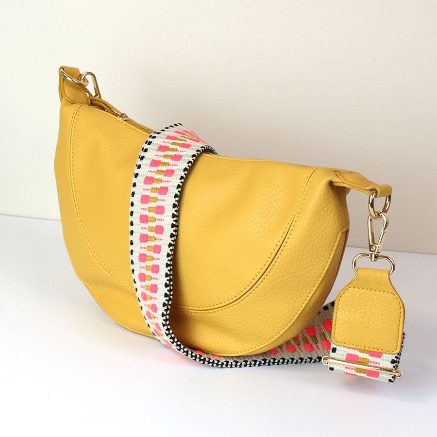 Yellow vegan leather half moon bag with zig-zag strap