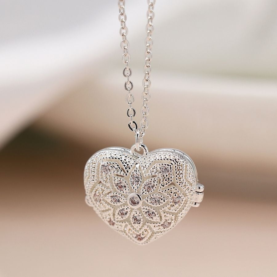 Silver plated heart shaped filigree and crystal locket