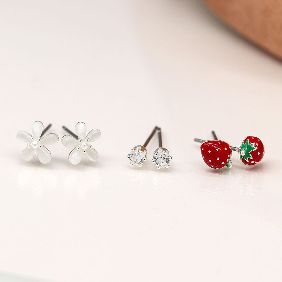 Silver plated strawberry and flower triple stud set