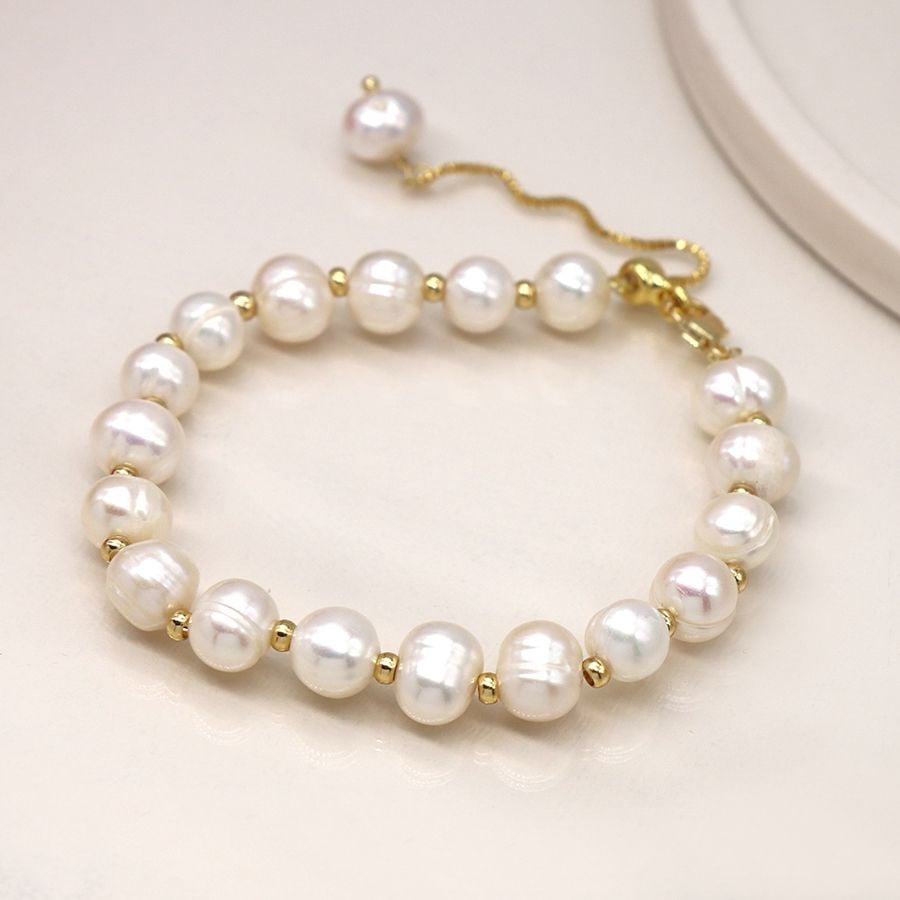 Ivory freshwater pearl and golden bead bracelet