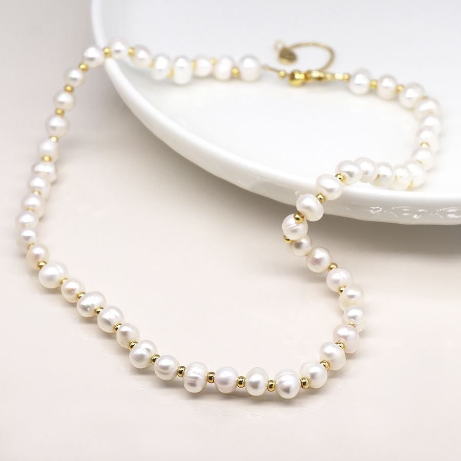 Ivory freshwater pearl and golden bead necklace