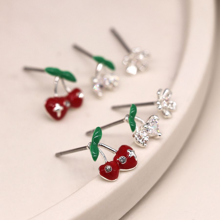 Silver plated cherry and flower triple stud set