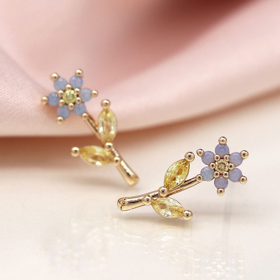 Faux gold flower stem crystal earrings