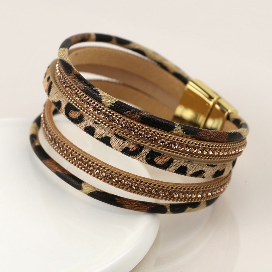 Multistrand leopard print and golden element bracelet