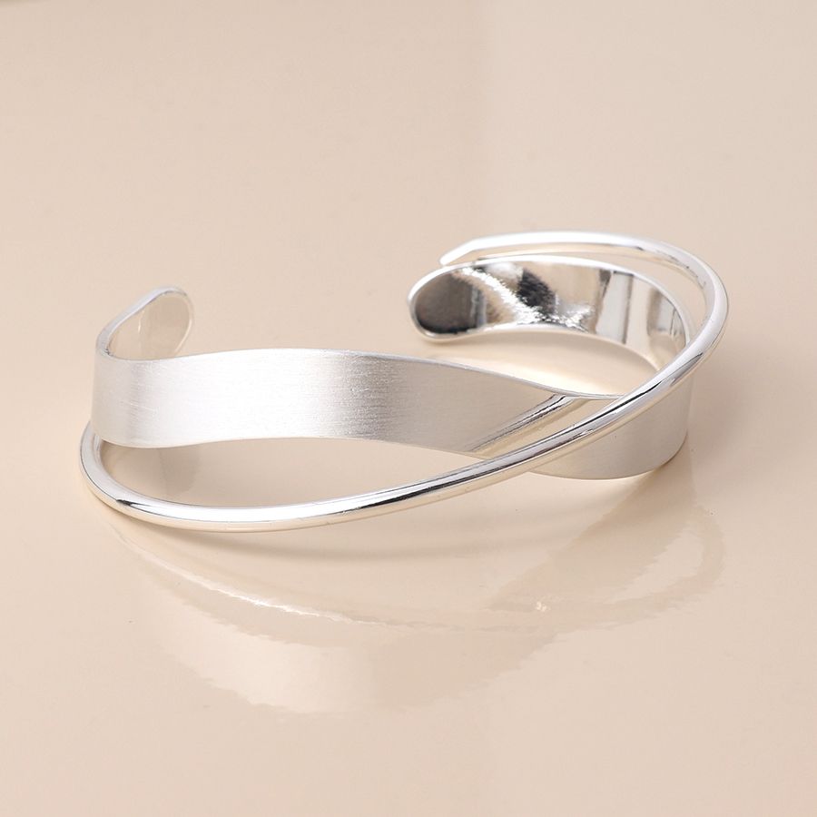 Silver plated brushed and smooth twist bangle