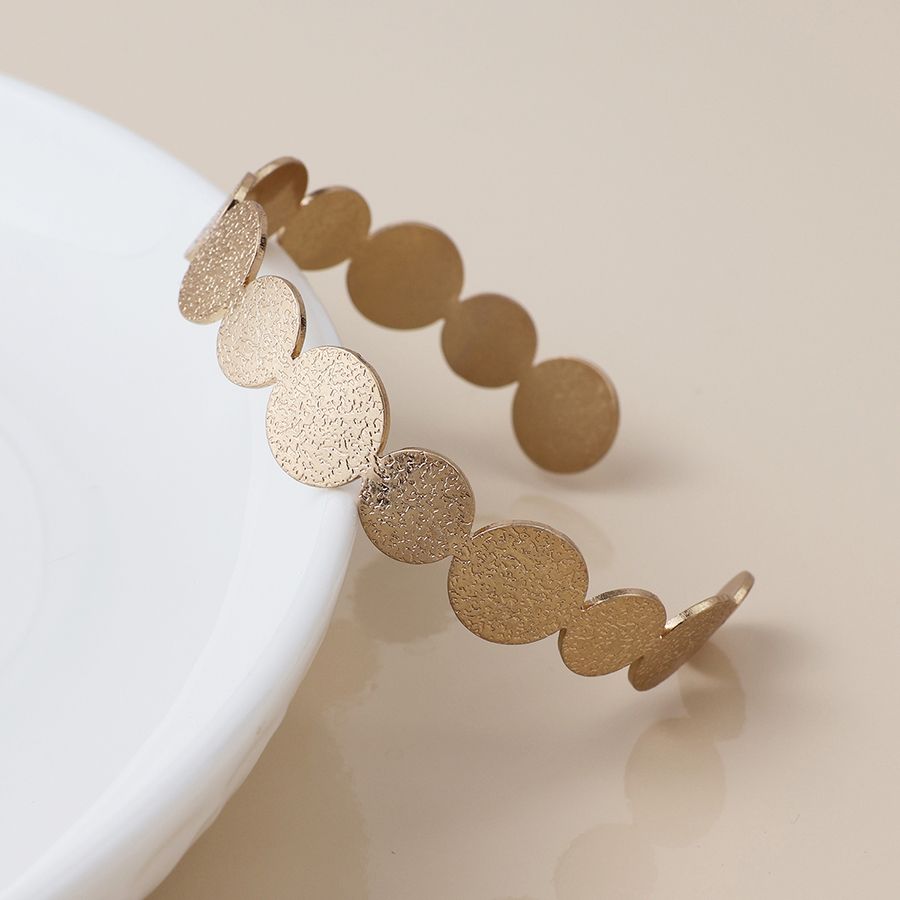 Golden dappled disc bangle