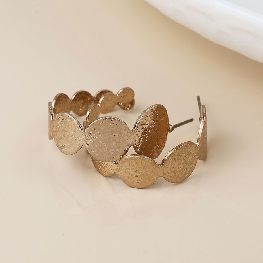 Golden dappled disc hoop earrings