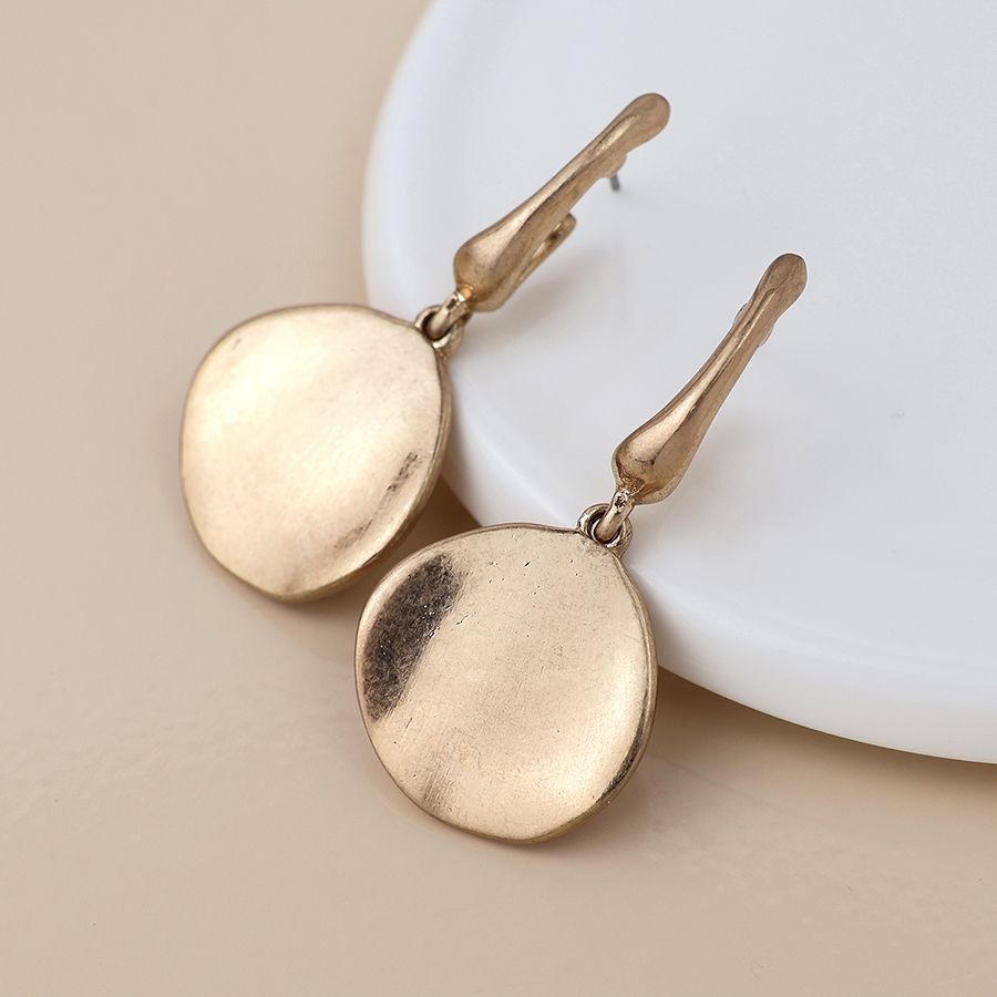 Golden worn disc drop earrings