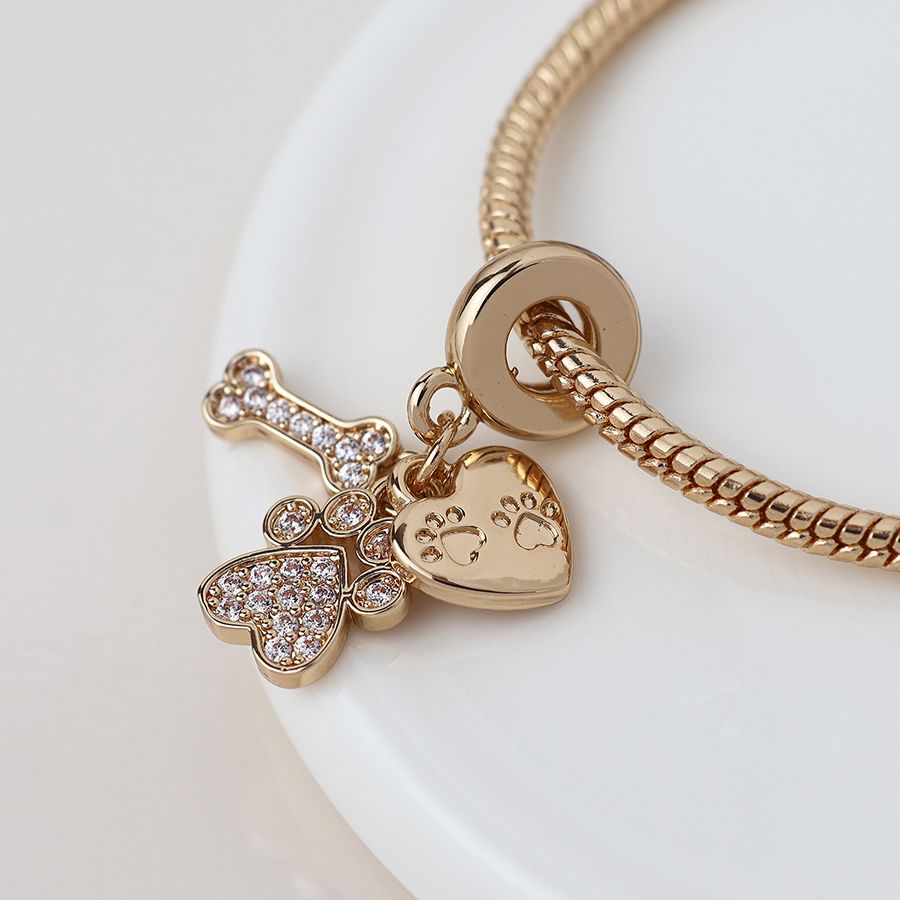 Golden crystal paw, bone and heart print charm bracelet