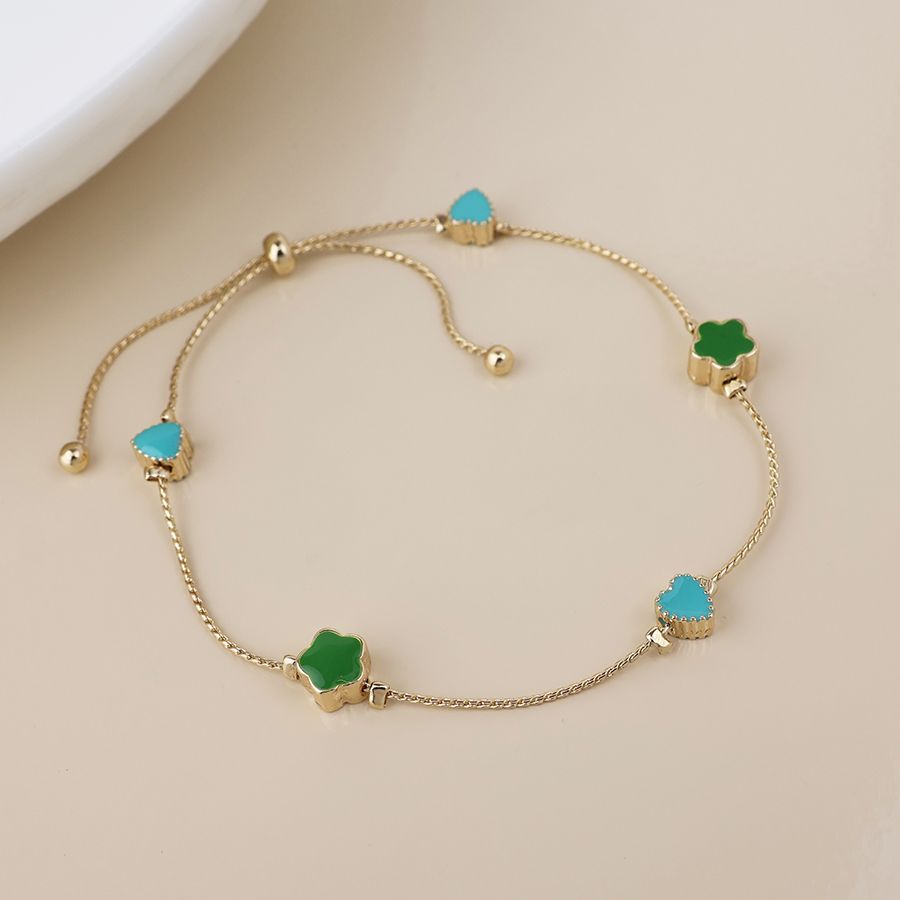 Golden flowers and hearts station bracelet