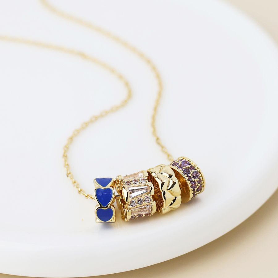 Golden mixed crystal and blue rings necklace
