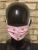 Candy pink face mask with bees on manikin -front