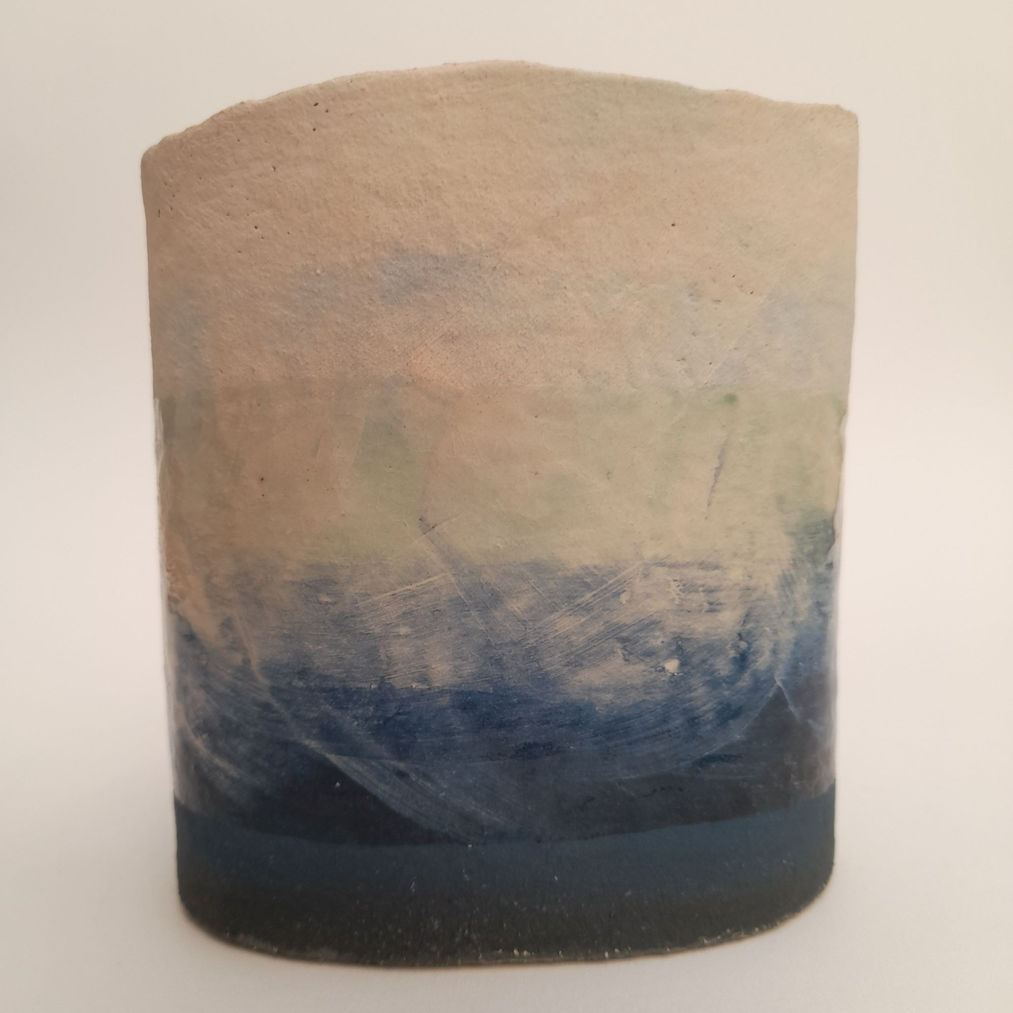 rough edged vase with seascape on sides