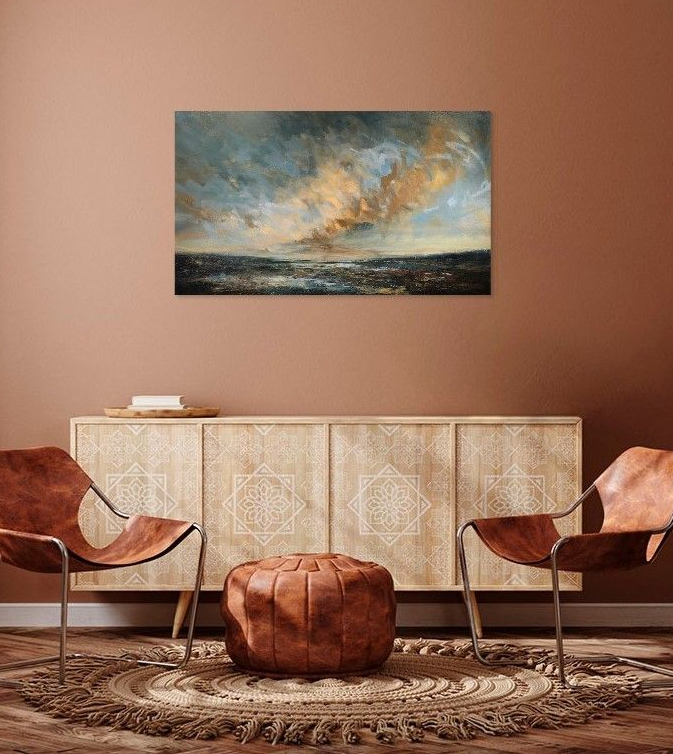Sky painting on soft orange wall with chairs