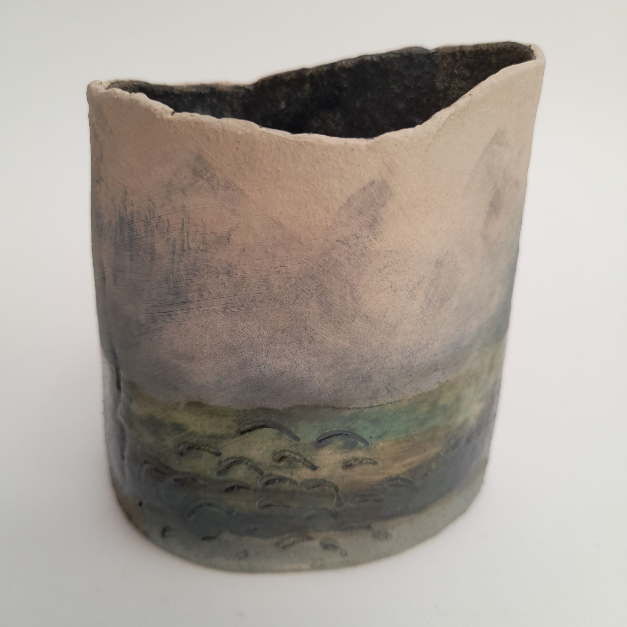 rough edged vase with seascape on sides