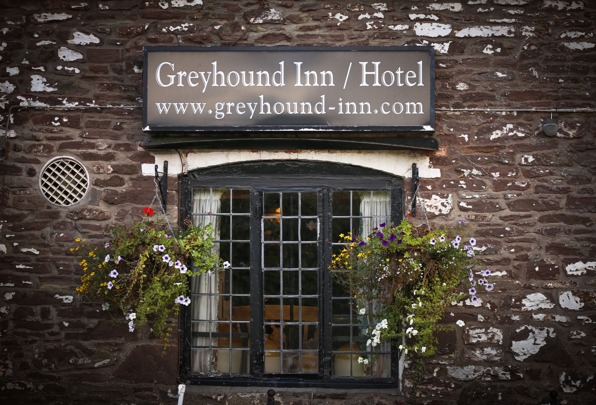The Greyhound Inn sign