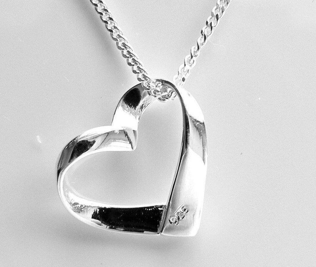 Silver floating heart on sale necklace