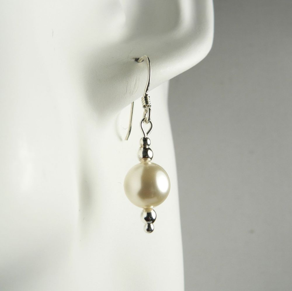 Sterling silver drop earrings made with 8mm cream Swarovski crystal pearls, in a gift box