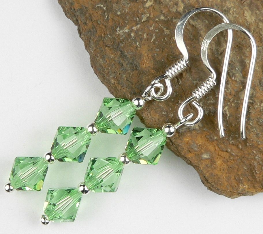 Earrings made with green Peridot Swarovski Elements