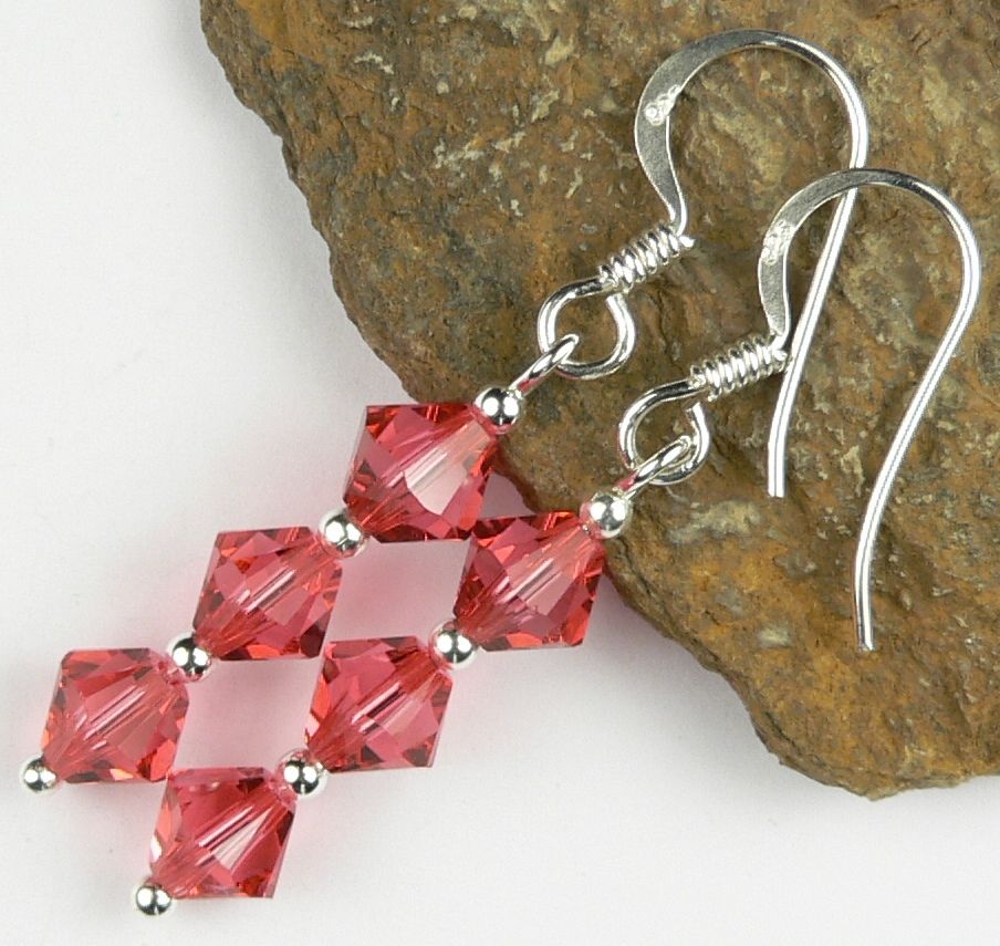 Sterling silver earrings made with 6mm bicone Swarovski Elements in a gift box - Padparadscha